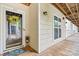 Charming entryway to unit #59 with a welcoming wreath and ample natural light at 860 Jetton St # 59, Davidson, NC 28036