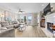 Bright living room with sliding glass doors to the balcony, a fireplace, and comfortable seating at 860 Jetton St # 59, Davidson, NC 28036
