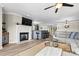 Cozy living room with fireplace, TV, ceiling fan, and open floor plan at 860 Jetton St # 59, Davidson, NC 28036