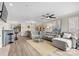 Open living room featuring large sectional sofa, ceiling fan, and many decorative pictures on the wall at 860 Jetton St # 59, Davidson, NC 28036