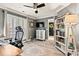 Inviting office features hardwood floors, neutral walls, custom shelving, and a large window with plantation shutters at 860 Jetton St # 59, Davidson, NC 28036