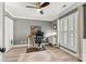 Bright office space with hardwood floors, neutral walls and a large window with plantation shutters at 860 Jetton St # 59, Davidson, NC 28036