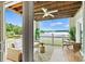 Inviting covered outdoor patio with wicker furniture offers scenic lake views and relaxing ambiance at 860 Jetton St # 59, Davidson, NC 28036