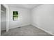 Neat bedroom with neutral carpet, a closet, and a window bringing in natural light at 908 Mccollough St, Statesville, NC 28677