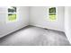 Well-lit bedroom featuring neutral walls and soft carpeting at 908 Mccollough St, Statesville, NC 28677