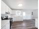 Bright kitchen with stainless steel appliances, white cabinets and an island at 908 Mccollough St, Statesville, NC 28677
