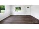 Bright living room featuring natural light, white walls, and modern flooring at 908 Mccollough St, Statesville, NC 28677