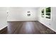 Bright living room featuring natural light, white walls, and modern flooring at 908 Mccollough St, Statesville, NC 28677