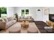 Bright living room featuring a cozy seating arrangement and modern decor, virtually staged at 908 Mccollough St, Statesville, NC 28677