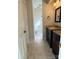 Modern bathroom with dual vanities, granite countertops, and a view into the toilet and shower area at 9125 N Vicksburg Park Ct, Charlotte, NC 28210