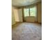 Comfortable bedroom with soft carpet, natural light from window, and plenty of open space at 9125 N Vicksburg Park Ct, Charlotte, NC 28210