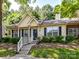 Charming yellow home with a cozy front porch and manicured landscaping at 9337 Four Mile Creek Rd # 101, Charlotte, NC 28277