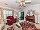 Inviting living room featuring a piano, creating a warm atmosphere at 9337 Four Mile Creek Rd # 101, Charlotte, NC 28277