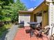 Brick patio offers an ideal outdoor space for dining and relaxation with a barbecue grill at 9337 Four Mile Creek Rd # 101, Charlotte, NC 28277