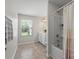 Bathroom featuring tub, shower, vanity with sink, and a window at 10111 Snowbell Ct, Charlotte, NC 28215