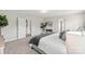Spacious bedroom features plush carpeting, a cozy bed, abundant natural light, and stylish decor at 10111 Snowbell Ct, Charlotte, NC 28215