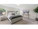 Cozy bedroom features plush carpeting, a comfortable bed, abundant natural light, and stylish decor at 10111 Snowbell Ct, Charlotte, NC 28215