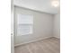 Bright bedroom featuring neutral carpeting, a window for natural light, and soothing paint at 10111 Snowbell Ct, Charlotte, NC 28215