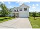 Charming two-story home with a well-manicured lawn, driveway, and an attached two-car garage at 10111 Snowbell Ct, Charlotte, NC 28215