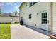 Home exterior with concrete patio, lawn, and access door, perfect for outdoor living at 10129 Loch Lomond Dr, Charlotte, NC 28278