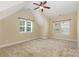 Bedroom with a vaulted ceiling and plenty of natural light from the windows at 10129 Loch Lomond Dr, Charlotte, NC 28278