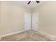 Bedroom featuring neutral walls, carpet, two closets, and ceiling fan at 10129 Loch Lomond Dr, Charlotte, NC 28278