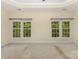 Bright main bedroom with large windows offering green tree views at 10129 Loch Lomond Dr, Charlotte, NC 28278