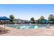 Relaxing community pool with lounge chairs and shade structures, perfect for outdoor enjoyment at 10129 Loch Lomond Dr, Charlotte, NC 28278