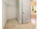 Spacious walk-in closet featuring carpet flooring and access to the Primary bathroom at 10129 Loch Lomond Dr, Charlotte, NC 28278