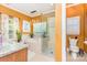 Bright bathroom featuring a glass-enclosed shower and a soaking tub at 10203 Loch Lomond Dr, Charlotte, NC 28278