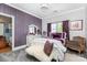 A calming bedroom featuring purple accents and a carpeted floor at 10203 Loch Lomond Dr, Charlotte, NC 28278