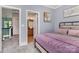 Carpeted bedroom boasts natural light, neutral walls, and walk-in closet at 10203 Loch Lomond Dr, Charlotte, NC 28278