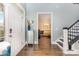 A grand foyer with hardwood floors, staircase and stylish decor at 10203 Loch Lomond Dr, Charlotte, NC 28278
