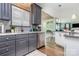 Modern kitchen featuring stainless steel appliances, gray cabinets and countertops at 10203 Loch Lomond Dr, Charlotte, NC 28278