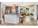 Open kitchen with gray cabinets, a kitchen island, and hardwood floors at 10203 Loch Lomond Dr, Charlotte, NC 28278