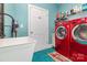 Bright laundry room featuring modern washer and dryer at 10203 Loch Lomond Dr, Charlotte, NC 28278