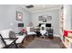 Well-lit office space with gray walls, hardwood floors, and custom built-ins at 10203 Loch Lomond Dr, Charlotte, NC 28278