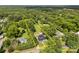 Aerial view of house and property with mature trees and land outlined in yellow at 1025 Old Us 80 Hwy, Gold Hill, NC 28071