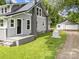 Exterior view highlighting the backyard, detached garage, and the well-maintained lawn at 1025 Old Us 80 Hwy, Gold Hill, NC 28071
