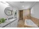 Bathroom with tiled floors, granite counters, updated fixtures and a separate shower and tub at 1025 Old Us 80 Hwy, Gold Hill, NC 28071