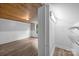 Bedroom with wood ceiling leads to closet with shelving, wood floors, and wainscoting at 1025 Old Us 80 Hwy, Gold Hill, NC 28071