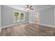 Bedroom featuring fresh paint, updated flooring, and multiple windows offering ample natural light at 1025 Old Us 80 Hwy, Gold Hill, NC 28071