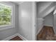 Closet featuring hardwood floors, neutral paint, a window, and wire shelving for optimal storage at 1025 Old Us 80 Hwy, Gold Hill, NC 28071
