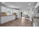 Bright dining room featuring wood floors, an open floorplan, and a wooden table with seating at 1025 Old Us 80 Hwy, Gold Hill, NC 28071