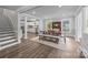 Bright dining room featuring wood floors, an open floorplan, and a wooden table with seating at 1025 Old Us 80 Hwy, Gold Hill, NC 28071