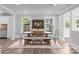 Bright dining room featuring wood floors, an open floorplan, and a wooden table with seating at 1025 Old Us 80 Hwy, Gold Hill, NC 28071