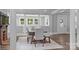 Bright dining room featuring wood floors, an open floorplan, and a wooden table with seating at 1025 Old Us 80 Hwy, Gold Hill, NC 28071
