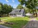 Charming property featuring a metal roof, and a lush green lawn at 1025 Old Us 80 Hwy, Gold Hill, NC 28071