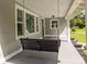 Inviting front porch with a porch swing, offering a relaxing outdoor space with views of the yard at 1025 Old Us 80 Hwy, Gold Hill, NC 28071