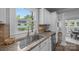 White kitchen featuring stainless appliances, granite countertops, and a stainless steel sink at 1025 Old Us 80 Hwy, Gold Hill, NC 28071